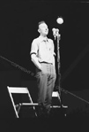 Pete Seeger standing at mike
