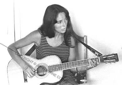 Joan Baez in striped jersey